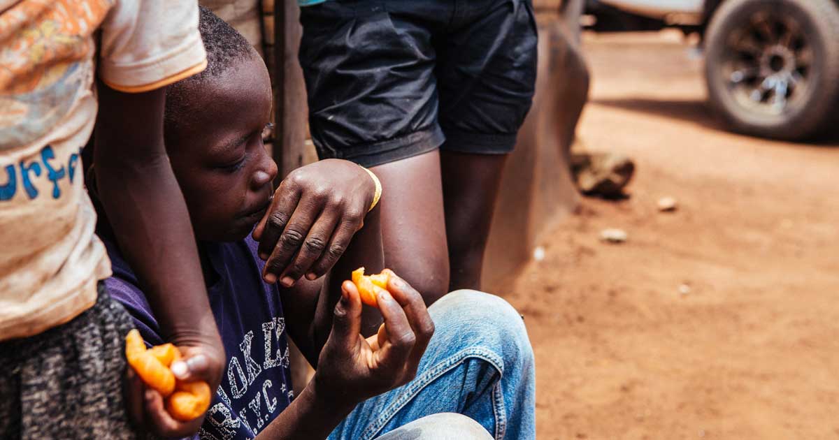 boy savoring a cheese puff